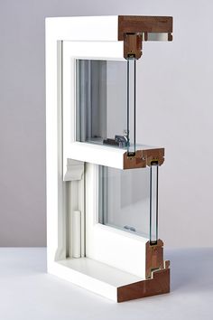 an open window with two pieces of wood sticking out of the bottom and one piece missing