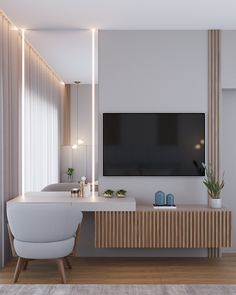 a tv mounted on the wall in a living room next to a white chair and table