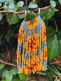 Long Orange Floral Design Beaded Fringe Earrings Made of Miyuki Beads in Blue colour (сolors may vary due to your screen settings) Length- 9 centimeters Width - 2.5 centimeters Earrings are perfect as a gift. Ear clasp- you can choose between options brass ear wire in silver color or 925 sterling silver clip on. Occasion - any occasion to enjoy your life and decorate every day with bright details. Traditional Blue Beaded Earrings With Tiny Beads, Traditional Blue Beaded Earrings, Orange Beaded Earrings With Round Beads For Festival, Orange Beaded Earrings For Festivals, Orange Round Beaded Earrings For Festivals, Multicolor Faceted Beaded Earrings For Festivals, Orange Beaded Earrings With Tiny Round Beads, Sunflower Family, Beaded Fringe Earrings