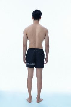 SUSTAINABLE GARMENT for the better future. Our swimshorts are now in recycled fabric. Water repellent and quick dry fabric perfect for swimming or gym. Available in black gold accent, black gunmetal accent and many more colors. This product helps end plastic waste. High quality metal tip color contrast drawstring Side pockets and back pocket Eyelets on the back Printed design Built in mesh underwear 100% RECYCLED POLYESTERmesh:100% POLYESTERFabric is imported from South KoreaDELICATE MACHINE WAS Black Swim Trunks With Built-in Shorts For Beachwear, Black Beachwear Swimwear With Drawstring, Black Beachwear Swimwear With Functional Drawstring, Black Swimwear Shorts With Pockets, Sporty Black Swimwear With Pockets, Black Sporty Swimwear With Pockets, Black Swimwear With Functional Drawstring And Short Shape, Workout Black Nylon Swim Trunks, Black Swim Trunks With Functional Drawstring