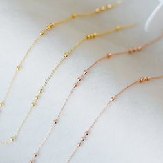 High quality real gold/ rose gold plated brass beaded chains, lead nickel free, color not easily tarnish. Material: real gold plated brass(both chain and beads) Size: chain 1.3mm thick, ball beads 3mm(see the last picture) Quantity: 1 meter=3.3 feet Bulk quantity wholesale is available, contact me! This link is for more gold chains: https://www.etsy.com/shop/Nbeads?ref=seller-platform-mcnav&search_query=gold+chain ❤ See more chains here: ❤ https://www.etsy.com/shop/Nbeads?ref=hdr_shop_menu&a Rose Gold Necklaces With Round Tiny Beads, Dainty Rose Gold Chain Necklace With Satellite Chain, Dainty Rose Gold Jewelry With Beaded Chain, Minimalist Rose Gold Satellite Chain Necklace, Rose Gold Beaded Chain Jewelry For Crafting, Rose Gold Beaded Chain Necklace As Gift, Rose Gold Beaded Chain Necklace Gift, Rose Gold Ball Chain Jewelry As A Gift, Dainty Rose Gold Necklace With Beaded Chain