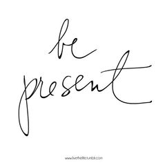 the word be present written in cursive handwriting on a white background with black ink