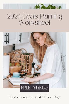 a woman working on her laptop in the kitchen with text overlay that reads, 20 goals planning worksheet free printable tomorrow is a mother's day