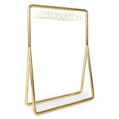 a gold metal clothes hanger on a white background