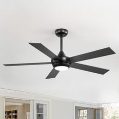 a black ceiling fan in a white room