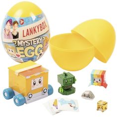 an assortment of toys including a toy truck, egg and other items for the game