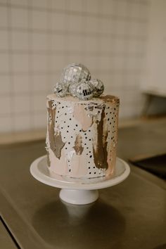 a decorated cake sitting on top of a white plate