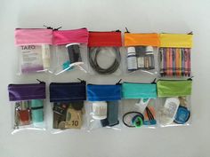 the contents of a travel kit are neatly organized in plastic bags on a white surface