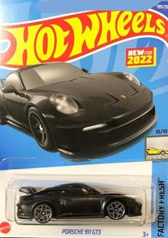 a black hot wheels car is on display