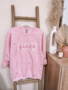 Embroidered Walk By Faith Sweatshirt | Christian Sweatshirt | Embroidered Sweatshirt | Gift | Embroidered Faith Sweatshirt Embroidered WALK BY Faith Sweatshirt.Embroidery size: approximately 11" in length (across chest) Sizes: Unisex Small, Medium, Large, XLarge, 2Xlarge-Fit is a little loose Color: PinkThread: White & Pink Wash & Care:-Wash in cold water with like colors on a gentle cycle-Tumble dry low or hang to dry Pink Custom Embroidered Tops For Fall, Pink Tops With Custom Embroidery For Fall, Pink Tops With Custom Embroidery In Relaxed Fit, Casual Pink Sweater With Embroidered Logo, Spring Cotton Sweater With Custom Embroidery, Spring Long Sleeve T-shirt With Letter Embroidery, Pink Embroidered College Sweatshirt, Pink Cotton Sweatshirt With Machine Embroidery, Pink Relaxed Fit Sweatshirt With Letter Embroidery