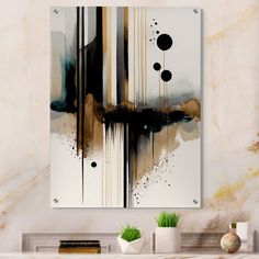 an abstract painting hangs on the wall above a fireplace