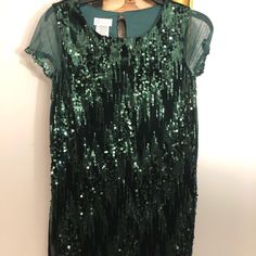 Cute Green Sparkly Dress Any Occasion. Green Short Sleeve Dress For Holiday, Green Short Sleeve Dress For Formal Occasions, Green Mini Dress For Holiday, Green Sparkly Mini Dress, Green Sequined Short Sleeve Dress, Green Mini Sequin Party Dress, Holiday Green Embellished Sequin Dress, Knee-length Green Sequin Dress, Green Sparkly Dress