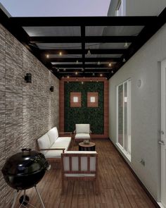 an outdoor living room with wood flooring and brick wall covering the ceiling, along with two white couches