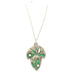 This fine size pendant is decorated with gingko leaves in relief standing out against a green enamelled background. slides open to reveal a mirror. The reverse is marked 900 and impressed with a dragon fly, the Meyle &Mayer's company's signature. Meyle & Mayer was founded in Pforzheim in 1889 and produced strong and expressive Art Nouveau jewellery. The pendant is accompanied by a period fine long silver chain with a length of 39.7 cm. Antique Green Locket Necklace, Green Engraved Medallion Necklaces, Green Engraved Medallion Necklace, Green Engraved Necklace For Collectors, Engraved Green Medallion Necklace, Green Enamel Necklace With Large Pendant, Green Art Nouveau Pendant Necklace, Bijoux Art Nouveau, Gingko Leaves