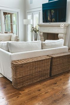 a living room filled with furniture and a fire place in the middle of the room