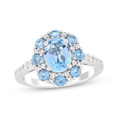 This exquisite and colorful blue topaz ring is one she'll want to wear always. Sterling silver A cool oval-cut Swiss blue topaz is the stunning focal point Round-cut Swiss blue topaz stones and white lab-created sapphires halo the center More white lab-created sapphires shimmer on the shank for all-over sparkle Oval Topaz Ring With Accent Stones, Dazzling Oval Topaz Ring With Center Stone, Oval Topaz Ring With Gemstone Accents, Oval Blue Topaz Ring With Diamond Accents, Oval Blue Topaz Ring With Accent Stones, Dazzling Oval Blue Topaz Ring, Fine Jewelry Oval Blue Topaz Ring, Oval Blue Topaz Ring In Fine Jewelry Style, Oval Blue Topaz Ring Fine Jewelry