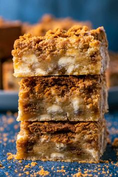 three pieces of biscoff blondies stacked on top of each other with the title above it