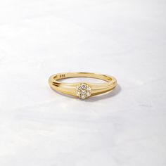 Sweet, simple, and dainty ring. Perfect for a minimalist look, or for stacking. It has a fun vintage look to it, making it one-of-a-kind and special! Made of 925 Sterling Silver Available in 14k Gold or Rhodium Plating We use a THICK 14k Gold plating - for a piece that will last you years to come! VERY HIGH QUALITY Made of the highest grade of cubic zirconia stones for an authentic look Available in sizes 4-12 Ring Sizer Dainty Everyday Stackable Rings With Prong Setting, Dainty Stackable Signet Ring With Round Band, Classic Stackable Cluster Ring In 14k Gold, Classic 14k Gold Stackable Cluster Ring, Minimalist Yellow Gold Cluster Ring For Anniversary, Minimalist Yellow Gold Flower Ring For Anniversary, Classic Stackable Birthstone Ring For Promise, Classic Stackable Birthstone Promise Ring, Minimalist 14k Gold Cluster Ring For Anniversary