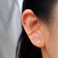 Our tiny diamond earring is perfect for any occasion. It's small size and minimal style makes it perfect as an everyday essential! Wear these studs for your cartilage or earlobe piecing, wear them alone or wear them as an earring stack! Our tiny diamond earring is shipped in a high-quality jewelry bag for storage. SHIPS 1-2 DAYS **Details -A thick layer of 14k Gold layered on .925 sterling silver + e-coat (anti-tarnish) -Clear CZ Stones -Stud size: 2mm -Comes in a pair -Post backs -Hypoallergen: Dainty Pierced Ear Climbers As A Gift, Dainty Single Ear Climber For Parties, Tiny Minimalist Piercings For Anniversary, Dainty Huggie Ear Climbers For Gift, Dainty Huggie Ear Climbers As Gift, Minimalist Pierced Cartilage Earrings For Party, Minimalist Cartilage Earrings For Party, Dainty Single Cartilage Earring For Party, Dainty Hypoallergenic Ear Climbers As Gift