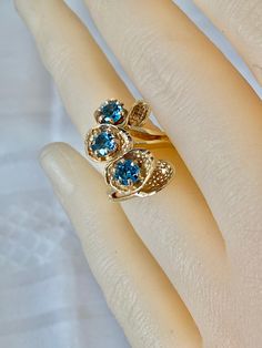 14K  Solid Gold Blue Topaz 3 Gemstones Yellow Gold Robins Nest Design Yellow Gold Ring size 4    Can resize however we sell only  Grams: 5.76 Hallmark: 14K AE Visit our Etsy Shops HauteCoutureLaLa  TrendsCouture  BeautifulPatina  LastingTrends  BorrowedTrends  Free Shipping on orders over $35.00 however if there is a return buyer to refund seller for the free shipping cost to seller.Seller is not responsible for mailing to the incorrect address registered with Etsy from buyers. Please correct th Fine Jewelry Blue Topaz Three Stone Ring, Blue Topaz Three-stone Ring, Blue Topaz Three Stone Ring For Anniversary, Yellow Gold Three Stone Topaz Ring For Anniversary, Three-stone Blue Topaz Ring For Anniversary, Three Stone Blue Topaz Ring For Anniversary, Blue Three Stone Birthstone Ring For Anniversary, Three Stone Topaz Anniversary Ring, Formal Blue Topaz Three Stone Ring