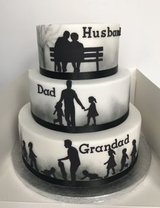 three tiered cake with silhouettes of people holding hands and the words husband, dad, and grandad on it