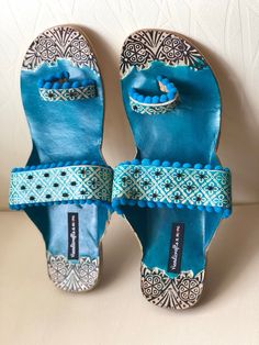 Blue embossed and Beaded Boho Style Kolhapuri Chappals/Sandals for Women, Shoes for Women, Women Flats, Slip Ons, Indian Ethnic flop flip, Royal shoes, traditional style Women, Wedding Shoes, Bridal Shoes An enticing and comfortable pair of Indian slippers. Must have in your shoe collection. Contemporary sandals which will compliment every kind of outfit. PERFECT FOR ANY OCCASION AND ANY OUTFIT!! SOLE SIZE: *US 6-------Size 36---------23.5 cms (Foot Size) *US 7--------Size 37---------23.9 cms (F Traditional Leather Flip Flops For Festivals, Traditional Blue Closed Toe Sandals, Traditional Leather Flip Flops With Single Toe Strap, Bohemian Blue Closed Toe Sandals, Traditional Open Toe Flip Flops For Festivals, Traditional Blue Open Toe Sandals, Traditional Toe Post Flip Flops For Festival, Bohemian Blue Leather Sandals, Traditional Fair Trade Sandals With Round Toe