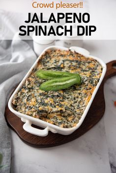 a casserole dish with jalapeno and spinach dip