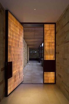 the hallway is lined with stone walls and flooring