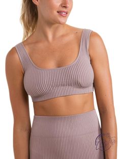 This seamless sports bra sits just on top of the rib cage. It features a seamless construction, an all-over ribbed texture, and a round scoop neckline on both the front and the back. Fabric: 92% Nylon & 8% Spandex. Seamless technology. Moisture-wicking. Four-way stretch. Sports Ribbed Scoop Neck Sports Bra, Ribbed Seamless Sports Bra For Workout, Ribbed Scoop Neck Sports Bra In Athleisure Style, Ribbed Seamless Workout Sports Bra, Ribbed Scoop Neck Crop Top For Yoga, Athleisure Ribbed Scoop Neck Sports Bra, Ribbed Seamless Sports Bra For Sports, Sporty Ribbed Scoop Neck Sports Bra, Ribbed Seamless Sports Bra For Yoga