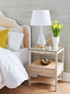 Add a touch of feminine elegance to your living room or bedroom with our woven cane Alice Side Table. Scalloped edge detailing and woven-cane shelves give the Alice Side Table an airy quality and moderate formality. The design includes clear glass panels which cover the woven cane providing protection, while soft-closing glides and cerused oak finish elevate the look of this versatile piece. Our Alice Scalloped Edge Side Table is the perfect addition to any decor, whether placed in a coastal cot