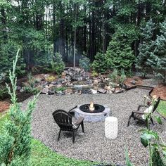 an outdoor fire pit surrounded by chairs and trees