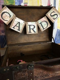 an old trunk with some cards hanging from it