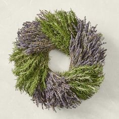 a wreath made out of lavender and green grass