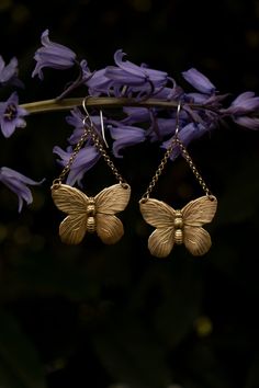 A beautiful symbol of metamorphosis and transformation. These wonderfully detailed butterfly earrings (or moth if you prefer) have a realistic look in an antique style. Crafted from solid raw (not plated) brass with solid raw brass chain and solid sterling silver ear hooks. These earrings are a good size, but very light weight. I added a patina to enhance the antique feel and highlight the texture. Be sure to check out my butterfly pin to match! length: 2 1/2 inches long including the ear wire w Bohemian Butterfly Nickel-free Jewelry, Bohemian Butterfly Earrings For Pierced Ears, Bohemian Butterfly Jewelry With Pierced Design, Unique Butterfly-shaped Jewelry With Matching Earrings, Unique Nickel-free Butterfly Earrings, Gold Butterfly-shaped Sterling Silver Earrings, Gold Butterfly Sterling Silver Earrings, Gold-plated Sterling Silver Butterfly Earrings, Vintage Gold Butterfly Jewelry