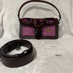 Coach Tabby Purple And Maroon Leather Handbag With Embellished Velvet Flap And Gold Hardware. Five Interior Pockets, One That Zips And One Slim Exterior Cell Phone Pocket. Please Message Me If You Have Any Questions. #Coach #Leather #Velvet #Floral #Gold #Purse Designer Coach Clutch Shoulder Bag, Designer Coach Satchel With Removable Pouch, Designer Coach Satchel With Detachable Strap, Coach Tabby, Gold Purse, Purple Purse, Maroon Leather, Pretty Bags, Coach Bag