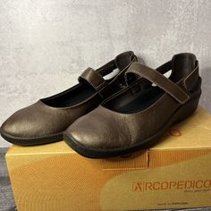 Introducing The Arcopedico L51 Slip-On Shoe, Perfect For Travel, Activewear, Casual Outings, And Workwear. This Comfortable And Stylish Shoe Features A Bronze Color With A Metal Theme, And Is Designed For Women With A Us Shoe Size Of 9 And Eu Shoe Size Of 40. The Shoe Has A Flat Heel Height Of Under 1 Inch, Making It Ideal For Walking Activities. The Arcopedico L51 Slip-On Shoe Is Made With A Textile Upper Material And Synthetic Lining Material, Ensuring Durability And Comfort. Its Slip-On Closu Arcopedico Shoes, Walking Activities, Casual Shoe, Stylish Shoes, Bronze Color, Slip On Shoes, Flat Shoes Women, Loafer Flats, 1 Inch