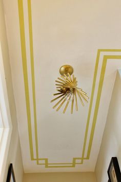 the ceiling is painted in yellow and white