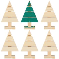 wooden christmas trees are arranged in rows on top of each other, and one is green