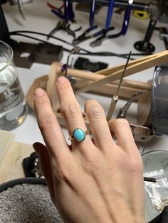 Simple American Mined blue turquoise set on 14k yellow gold. Solid 14k yellow gold fully hallmarked. 1.4mm band width. 8mmX 10mm Genuine North American turquoise. All of our jewelry will arrive in custom packaging ready for gift giving. LEAD TIME: Made to order will take 10-14 days. FOLLOW US ON: Instagram: @roseandchoc Facebook: /Roseandchoc Pinterest: @Roseandchoc Heirloom Turquoise Round Jewelry, Yellow Gold Turquoise Ring With Polished Finish, Handmade 14k Gold Oval Cabochon Jewelry, Sterling Silver Turquoise Ring In Yellow Gold, Sterling Silver Turquoise Ring With Yellow Gold Gemstone, Turquoise Ring With Bezel Setting, Turquoise Gemstone Ring In Yellow Gold Sterling Silver, Handmade Turquoise Ring In Yellow Gold, Handmade Yellow Gold Turquoise Ring