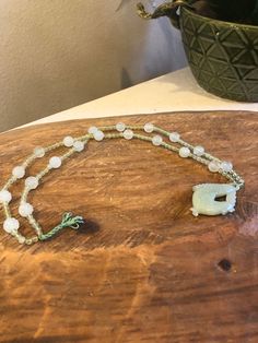 "This gorgeous vintage jade necklace is 12 inches long and has a jade fish pendant. It is beaded with jade beads and is in good condition. Lovely gift idea and beautiful collector's piece. We disclose as much as we know about an item. Our items are vintage, gently used pieces, (with the exception of a few handmade products.) They may have flaws or wear. Check out the pictures to ensure you know what you are buying. All products are \"as is\" condition. If you are not satisfied, we may offer a fu Single Strand Jade Beaded Necklace For Healing, Beaded Jade Necklace, Adjustable Jade Necklace With 108 Beads, Spiritual Single Strand Jade Beaded Necklace, Hand-strung Jade Beaded Necklaces For Jewelry Making, Vintage Jade Bead Necklaces, Adjustable Vintage Jade Necklaces, Vintage Jade Beaded Necklace, Nature-inspired Jade Necklace With Gemstone Beads