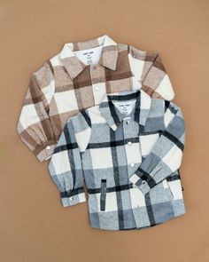 Unleash your child's daring style with our Black Plaid Jacket! Made with a cozy blend of wool and polyester, this jacket is perfect for layering and keeping your little one warm. The lined interior eliminates itchiness, while the stylish design adds a touch of adventure to any outfit. It's the perfect choice for stylish and adventurous kids! Rad Clothes, Denim Outerwear, Brown Plaid, Jogger Shorts, Jean Top, Top Graphic Tees, Plaid Jacket, Pajama Top, New Print