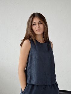 "Midnight blue sleeveless linen top. Handmade linen basic tank top. Creating this collection I was thinking, first of all, about comfort and feelings of those who would wear it. Natural high-quality softened linen, well-considered details and good quality of seams - this is exactly what will help your body to feel taken care of. For stitching parts, I never use an overlock, all internal seams are French (double). This fabric is certified Oeko-Tex Standard 100 03.0.4362. The top made of high-qual Everyday Linen Sleeveless Tank Top, Everyday Sleeveless Linen Tank Top, Sleeveless Linen Top For Everyday, Everyday Sleeveless Linen Top, Sleeveless Blue Linen Top, Blue Sleeveless Linen Top, Casual Blue Linen Tank Top, Blue Linen Sleeveless Top, Summer Linen Tops In Indigo