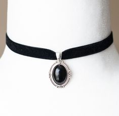 This Victorian inspired choker is made from black velvet ribbon and antique silver filigree pendant housing a black agate stone. - The choker measures 12 inches/30.5cm in length and 0.4 inches/10mm wide - The pendant is approximately 1 inch long and 0.75 inch wide - The choker closes with a lobster claw clasp at the back - One size fits most (for a neck of about 12.5 inches). there is a 2 inch extension chain at the back to accommodate larger neck sizes SHIPPING: Default shipping is by regular m Formal Black Jewelry With Black Ribbon, Black Velvet Ribbon, Black Agate Stone, Gothic Chokers, Black Velvet Choker, Black Choker Necklace, Vintage Inspired Jewelry, Velvet Choker, Filigree Pendant