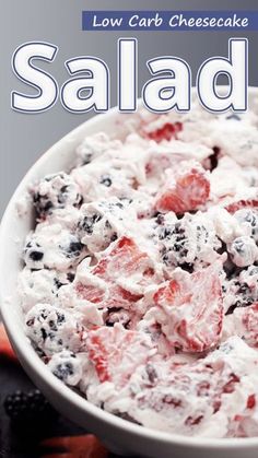 a white bowl filled with fruit salad on top of a table