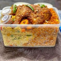 a plastic container filled with food on top of a table