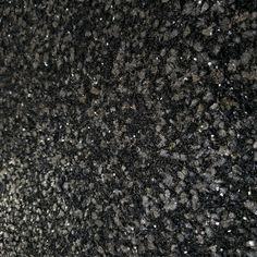 black and white speckled granite textured with silver flecks on the surface