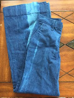 "The coolest vintage wide leg denim jeans! Trouser style fit, high on the waist. Big streaks down front and back with faded dye. Large belt loops. Large hip pockets, no pockets on butt. Made by Vicerer. Condition is like new. Sizing is modern 6/8, see measurements below: 28\" waist 36\" hips 32.5\" inseam 12\" leg opening laid flat" Washed Denim Blue Flare Jeans In Recycled Denim, Pre-washed Recycled Denim Blue Bottoms, Indigo Pre-washed Straight Leg Bottoms, Pre-washed Indigo Denim Bottoms, Mid-rise Washed Cotton Flare Jeans, High Rise Acid Wash Bottoms, Pre-washed Cotton Jeans In Washed Blue, Casual Faded Recycled Denim Flare Jeans, Mid-rise Washed Blue Cotton Flare Jeans