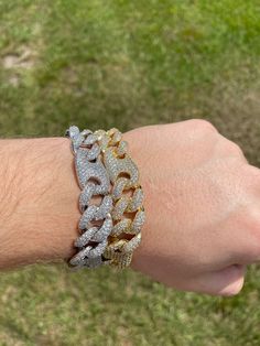 FAST SHIPPING!*TRUSTED SELLER**2300+ TRANSACTIONS* -Will be shipped through USPS with First Class Mail that includes tracking so you'll get it quick! -Don't confuse this with those cheap low quality cuban links that have glued in stones. -Premium 14k white gold OR 14k yellow gold plated diamond figaro cuban link Bracelet! -Plating is PVD which is the highest quality. -Stones are high quality VVS simulated lab diamonds(CZ)! Hand prong set and not glued in like the cheap ones! -Very nice box clasp Luxury Cuban Link Bracelet With Bling, Luxury Bling Cuban Link Bracelets, Cuban Link White Gold Chain Bracelet With Diamond Accents, Iced Out Diamond Bracelet, White Diamond Cuban Link Bracelets, White Gold Cuban Link Bracelets For Anniversary, Diamond White Iced Out Cuban Link Bracelets, Iced Out Diamond White Cuban Link Bracelets, Cuban Link Diamond Bracelet With Accents