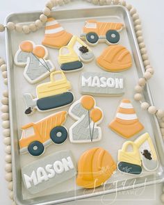 decorated cookies in the shape of construction vehicles