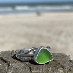 This beautiful piece of Sea Green Sea Glass was found in Hawaii. 925 Sterling silver and fine silver was use to create this handmade ring. The stacking bands are half round sterling silver, one is hammered. The main ring band is formed from half round sterling silver wire into a wavy band. This collection includes three separate rings. Size 10 Photos are taken outside in sunlight and shaded areas to show the way the light shines differently on the sea glass and pottery. Seaglass Rings, Funky Jewellery, Silver Smithing, Funky Rings, Sea Glass Ring, Sea Glass Crafts, Stacking Bands, Green Sea, Funky Jewelry